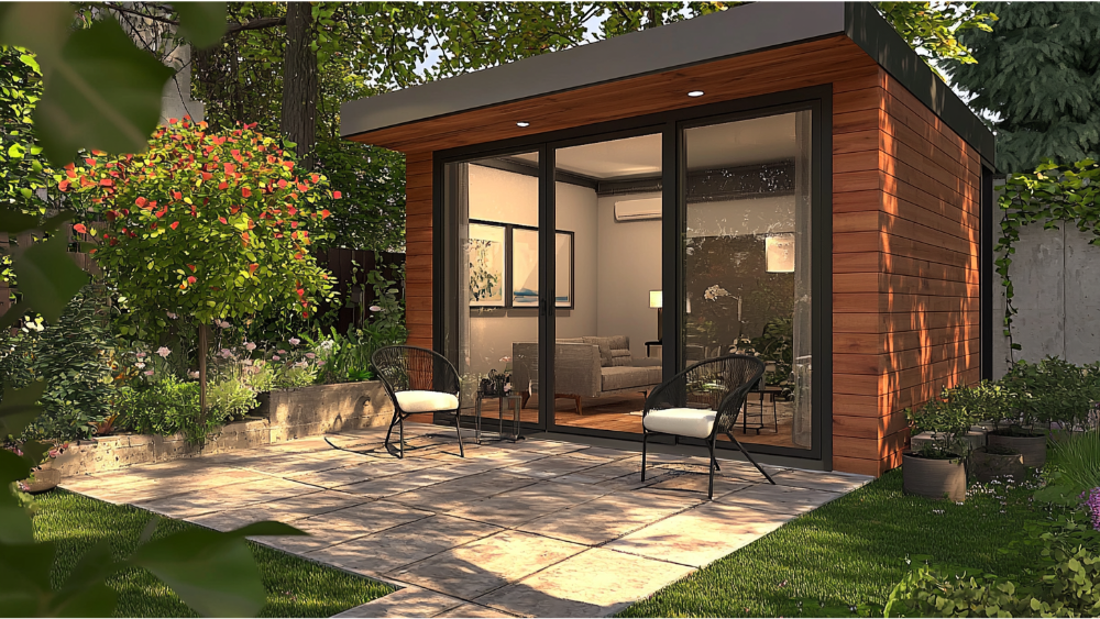 A compact modern guest house with wood siding, large glass doors, and a cozy patio area with two chairs and garden plants.